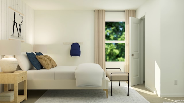 carpeted bedroom featuring baseboards