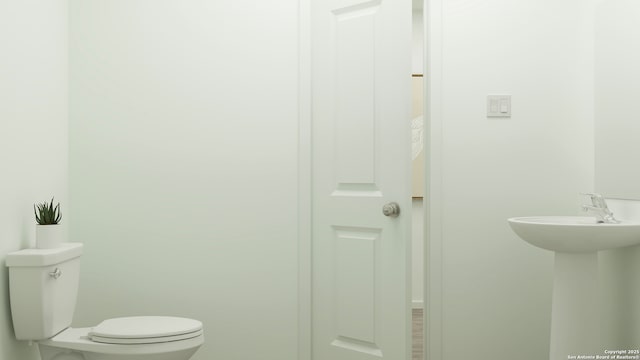 bathroom with a sink and toilet