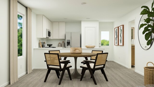 13510 Furyk Dr, San Antonio, TX 78221 - dining room with baseboards and light wood-style flooring