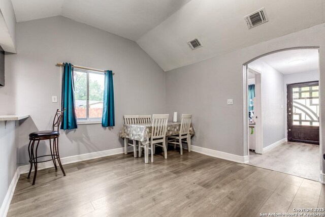 113 Chico Aly, San Antonio, TX 78225 - dining area featuring visible vents, arched walkways, and wood finished floors