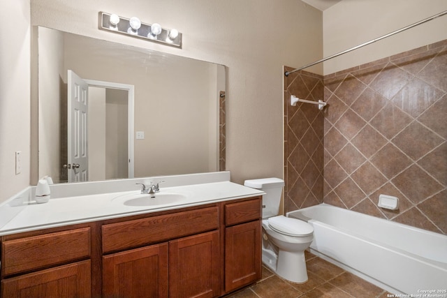 full bath featuring vanity, tile patterned floors, toilet, and tub / shower combination