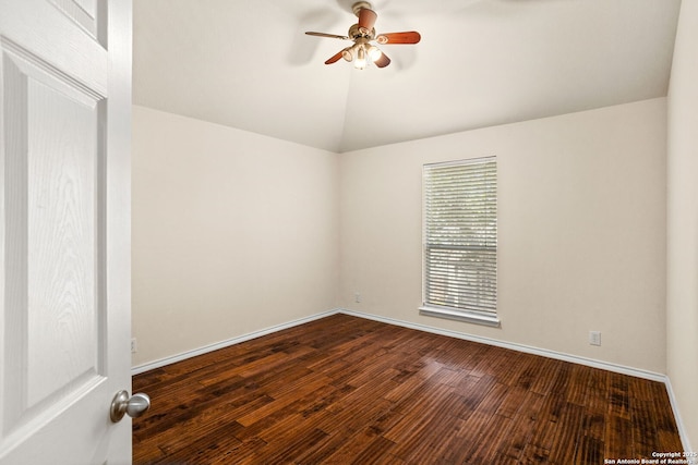 unfurnished room with baseboards, a ceiling fan, dark wood finished floors, and lofted ceiling
