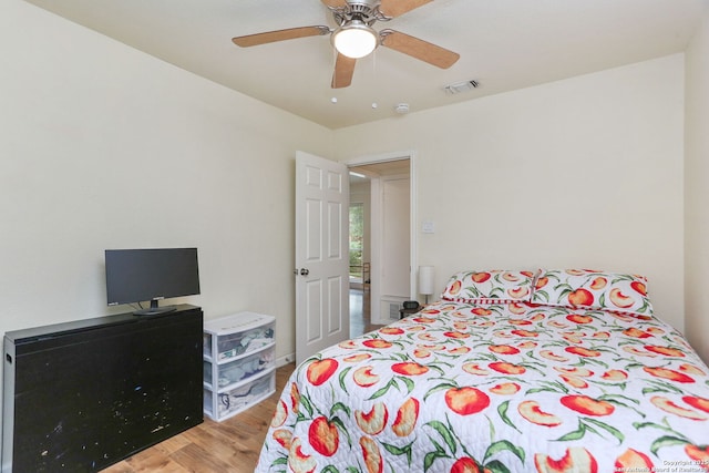 202 Beverly Dr, San Antonio, TX 78228 - bedroom featuring a ceiling fan, wood finished floors, and visible vents