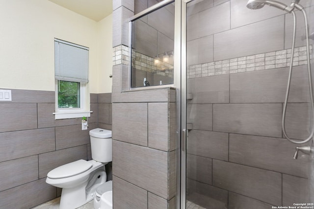 202 Beverly Dr, San Antonio, TX 78228 - full bath featuring tile walls, a wainscoted wall, a shower stall, and toilet