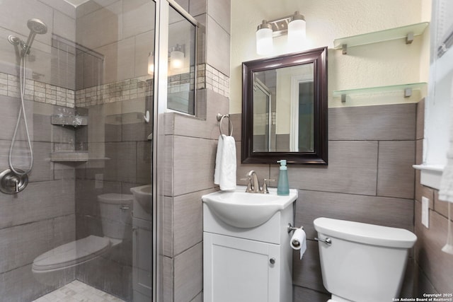 202 Beverly Dr, San Antonio, TX 78228 - full bathroom featuring vanity, toilet, tile walls, and a stall shower