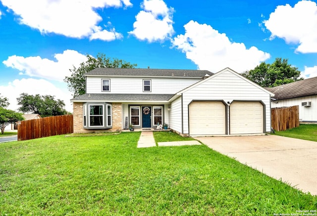 traditional home featuring an attached garage, a front lawn, fence, and driveway