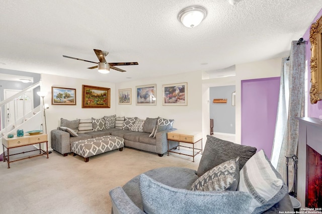 8034 Deadwood Rdg, Converse, TX 78109 - living area with carpet flooring, a textured ceiling, ceiling fan, and stairs