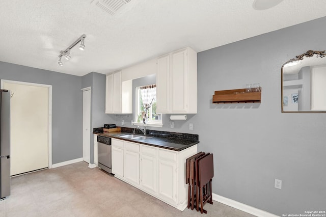 8034 Deadwood Rdg, Converse, TX 78109 - kitchen featuring visible vents, a textured ceiling, white cabinetry, a sink, and appliances with stainless steel finishes