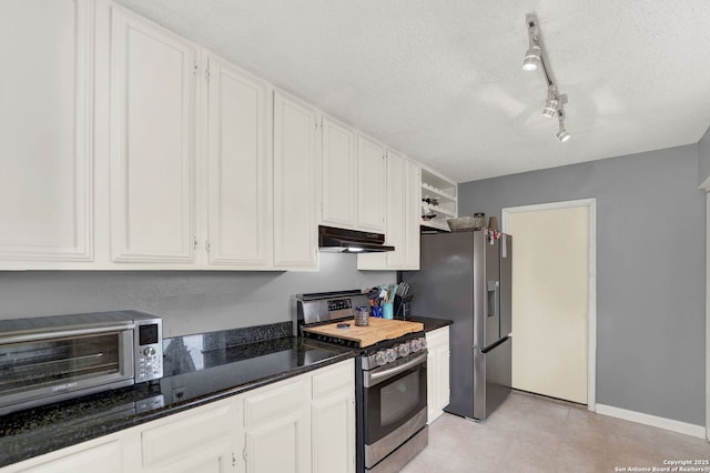 8034 Deadwood Rdg, Converse, TX 78109 - kitchen with a toaster, a textured ceiling, white cabinetry, under cabinet range hood, and stainless steel appliances