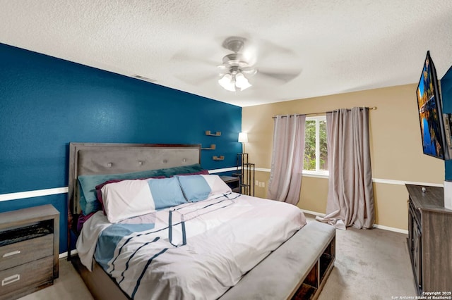 bedroom with carpet flooring, a ceiling fan, a textured ceiling, and baseboards