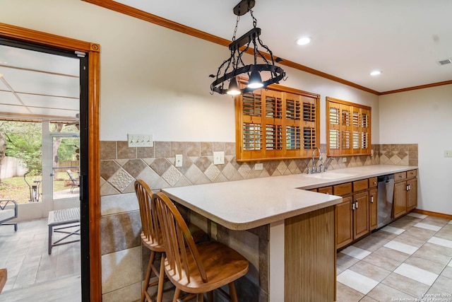 interior space featuring crown molding, visible vents, a sink, and dishwasher