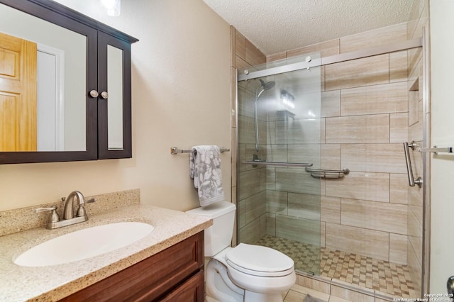 6763 Shadow Run, San Antonio, TX 78250 - bathroom featuring vanity, a stall shower, toilet, and a textured ceiling