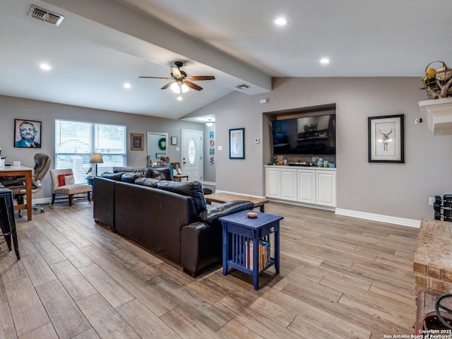 1639 Redwood, Seguin, TX 78155 - living area with lofted ceiling with beams, light wood-style floors, a ceiling fan, baseboards, and visible vents