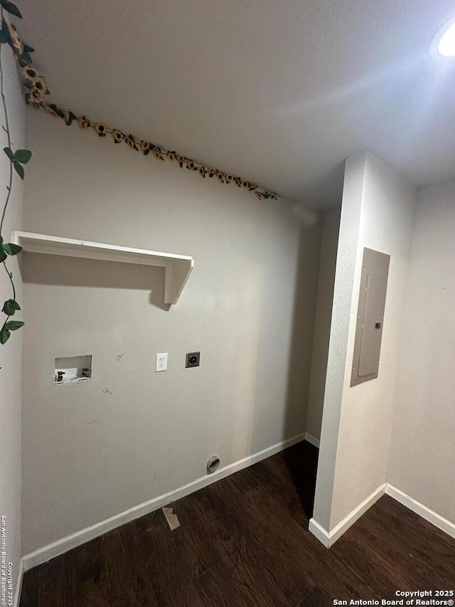 washroom featuring wood finished floors, baseboards, hookup for a washing machine, electric panel, and electric dryer hookup