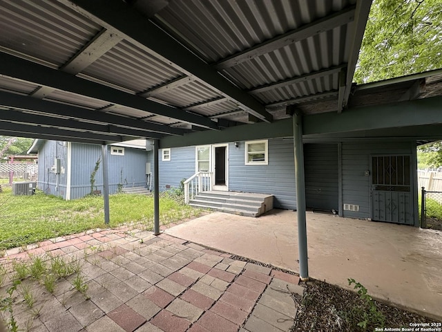 view of patio with fence and central AC