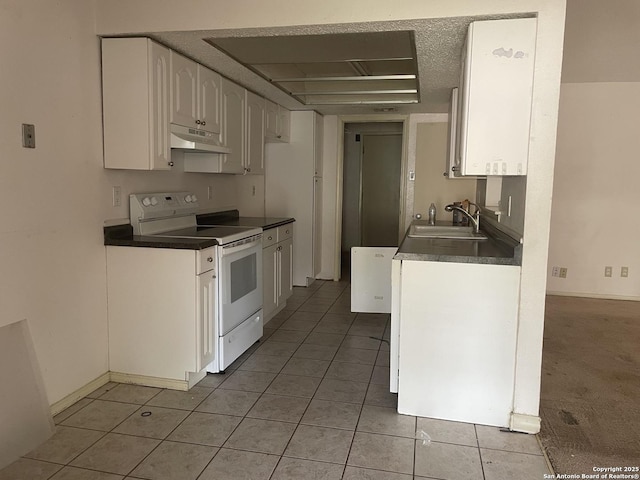 kitchen with white electric range, a sink, light tile patterned flooring, under cabinet range hood, and white cabinetry