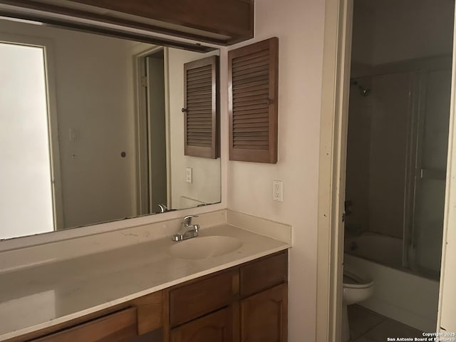 full bath featuring vanity, tile patterned floors, shower / bathtub combination, and toilet