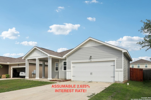single story home featuring a garage, board and batten siding, fence, and concrete driveway