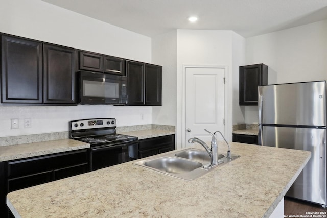 881 Bunton Reserve, Kyle, TX 78640 - kitchen featuring light countertops, a sink, and black appliances