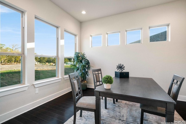 office featuring baseboards, recessed lighting, dark wood finished floors, and a healthy amount of sunlight