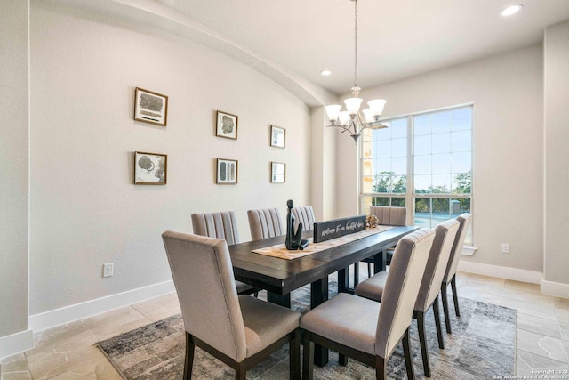 dining room with recessed lighting, baseboards, and a chandelier