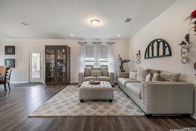 living area featuring a healthy amount of sunlight, baseboards, and visible vents