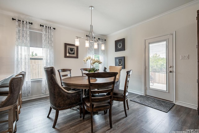dining area featuring baseboards, dark wood-style flooring, and crown molding