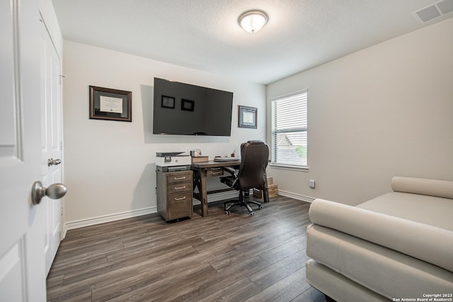 office area with baseboards, dark wood-style floors, and visible vents