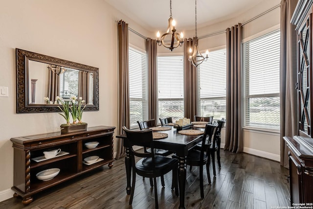dining space with baseboards, dark wood-style flooring, and a chandelier