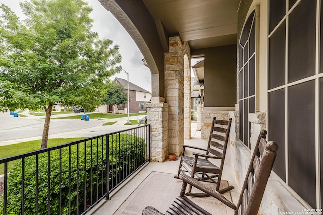 balcony featuring a porch
