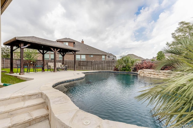 view of pool featuring a patio, a gazebo, a fenced in pool, and a fenced backyard