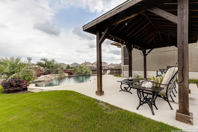 outdoor pool featuring a lawn, a gazebo, and a patio area