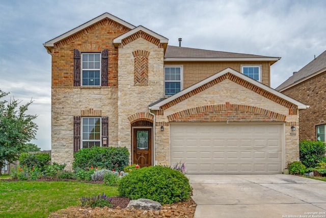 traditional-style home featuring concrete driveway, an attached garage, and stone siding