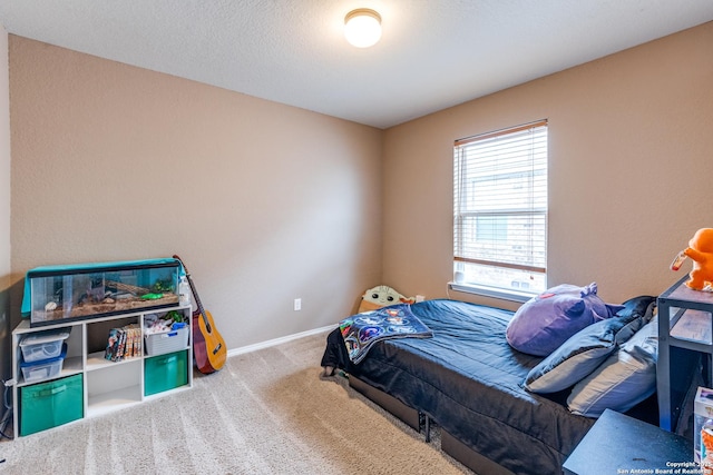 carpeted bedroom featuring baseboards
