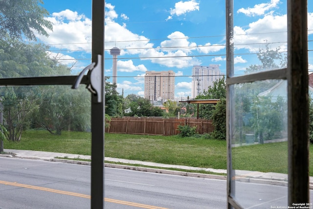 700 Dawson, San Antonio, TX 78202 - exterior space featuring fence, a view of city, and a lawn