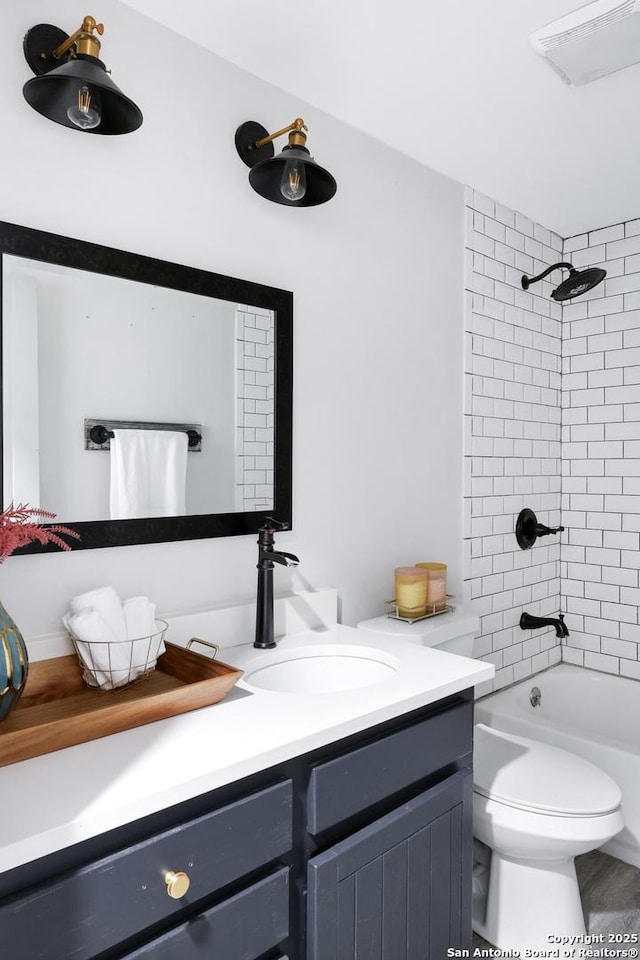 700 Dawson, San Antonio, TX 78202 - bathroom featuring vanity, washtub / shower combination, toilet, and visible vents