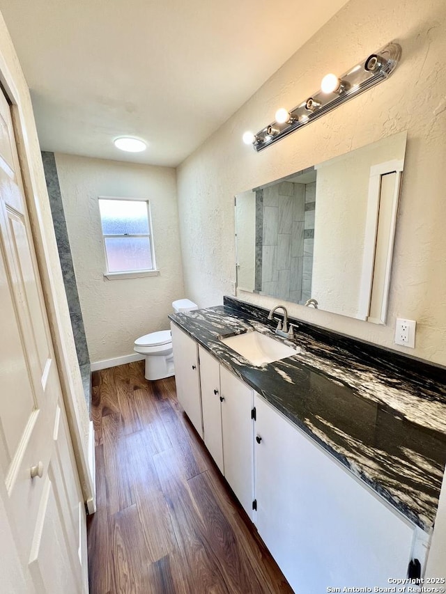 6803 Indian Lk, San Antonio, TX 78244 - full bathroom featuring toilet, a textured wall, wood finished floors, and vanity