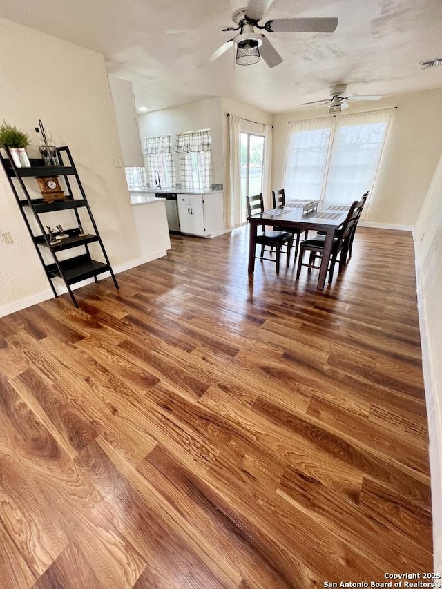 6803 Indian Lk, San Antonio, TX 78244 - dining space featuring baseboards, ceiling fan, and wood finished floors