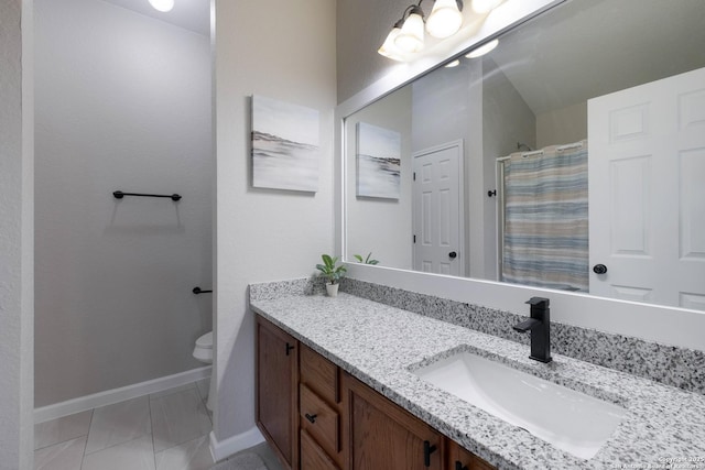 bathroom with baseboards, a shower with shower curtain, toilet, and vanity