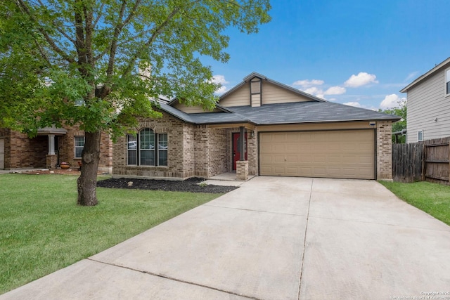 single story home featuring a front yard, a garage, brick siding, fence, and concrete driveway