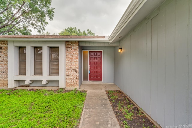 entrance to property with brick siding