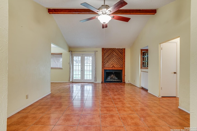 unfurnished living room with high vaulted ceiling, beamed ceiling, and a ceiling fan