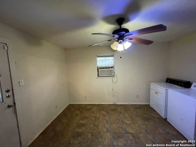 laundry area with washing machine and clothes dryer, laundry area, cooling unit, a ceiling fan, and baseboards
