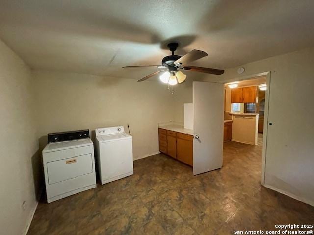 laundry room featuring independent washer and dryer, ceiling fan, baseboards, and cabinet space