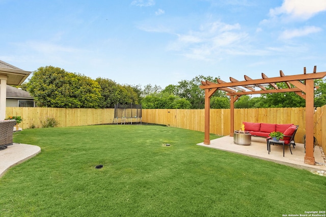 view of yard with a trampoline, a pergola, outdoor lounge area, a fenced backyard, and a patio area