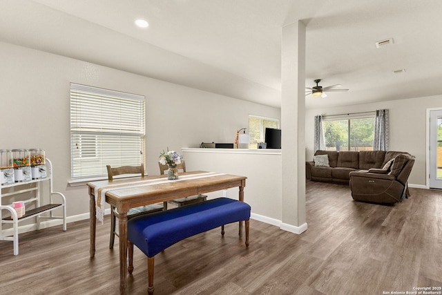 dining room featuring baseboards, ceiling fan, and wood finished floors