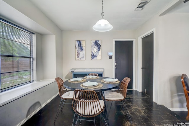 dining area with baseboards and visible vents