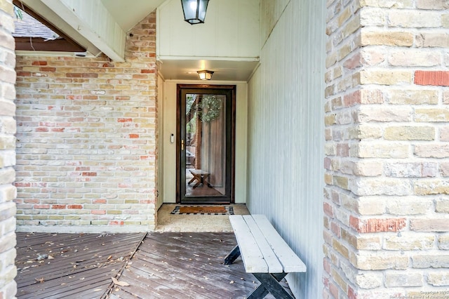 entrance to property with brick siding