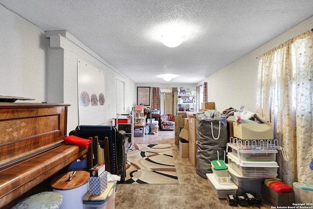 miscellaneous room with a textured ceiling