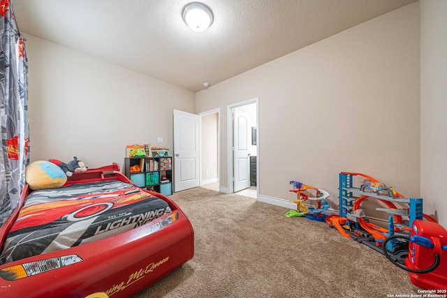 carpeted bedroom featuring baseboards